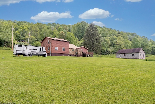 595 States Fork Rd, Metz, WV 26585 - view of grassy yard with a wooded view and an outdoor structure