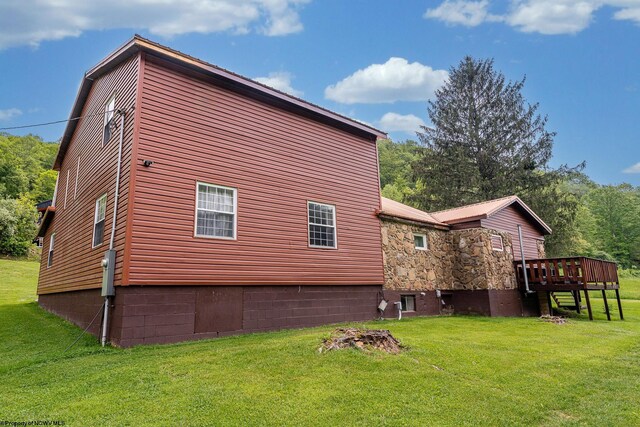 595 States Fork Rd, Metz, WV 26585 - view of side of home featuring a lawn and a deck