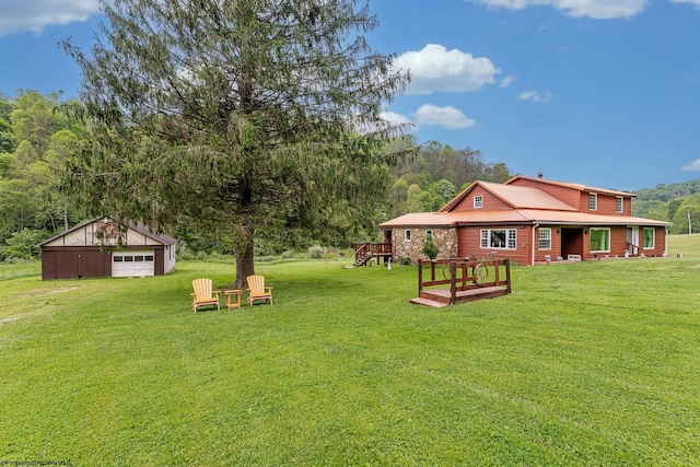 595 States Fork Rd, Metz, WV 26585 - view of green lawn with a garage and an outbuilding