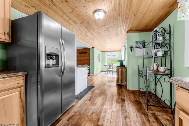 595 States Fork Rd, Metz, WV 26585 - kitchen featuring stainless steel fridge, wooden ceiling, wood finished floors, dark stone counters, and washer / dryer
