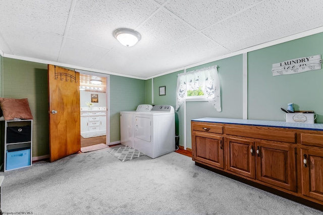 595 States Fork Rd, Metz, WV 26585 - laundry room with washer and dryer, light carpet, cabinet space, ornamental molding, and baseboards