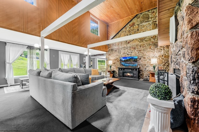 595 States Fork Rd, Metz, WV 26585 - carpeted living room featuring a stone fireplace, high vaulted ceiling, and wooden ceiling