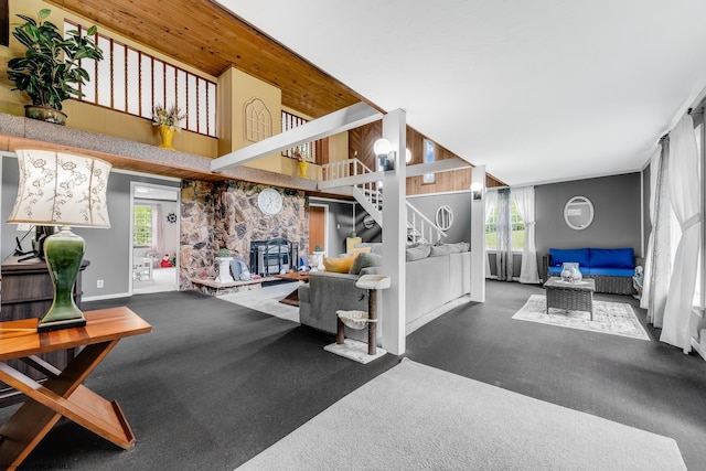 595 States Fork Rd, Metz, WV 26585 - living room with carpet flooring, stairs, and a wood stove