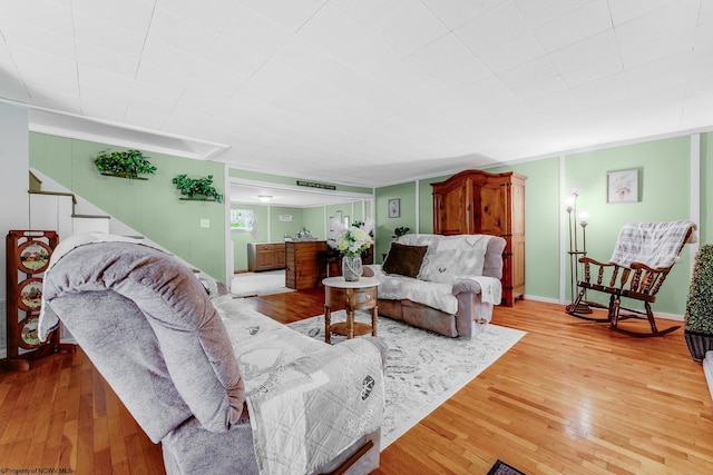 595 States Fork Rd, Metz, WV 26585 - living room with light wood-style floors, stairs, and baseboards