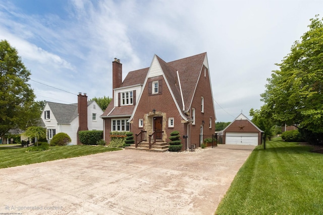 328 W Philadelphia Ave, Bridgeport, WV 26330 - tudor house featuring an outdoor structure, a front yard, a chimney, and a garage