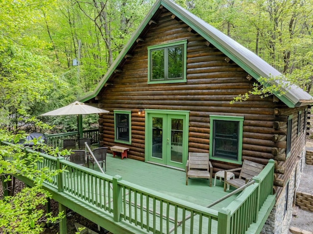1 Ginger Ct, Terra Alta, WV 26764 - back of property featuring log exterior, french doors, a wooden deck, and a forest view