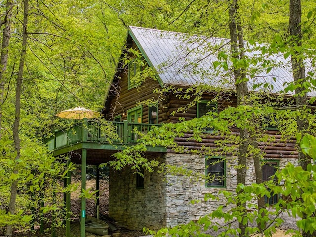 1 Ginger Ct, Terra Alta, WV 26764 - view of property exterior with a deck, log exterior, stone siding, and metal roof