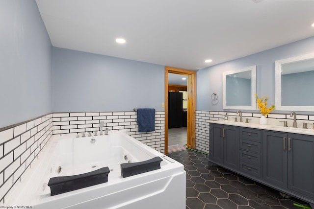 1 Ginger Ct, Terra Alta, WV 26764 - bathroom featuring tile walls, double vanity, a whirlpool tub, a wainscoted wall, and tile patterned flooring