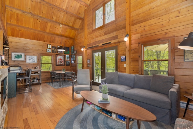 1 Ginger Ct, Terra Alta, WV 26764 - living area featuring wooden walls, high vaulted ceiling, wood-type flooring, wooden ceiling with exposed beams, and french doors