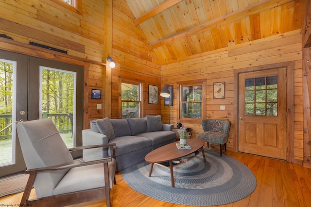 1 Ginger Ct, Terra Alta, WV 26764 - living area featuring wood walls, light wood-style flooring, high vaulted ceiling, wood ceiling with exposed beams, and french doors