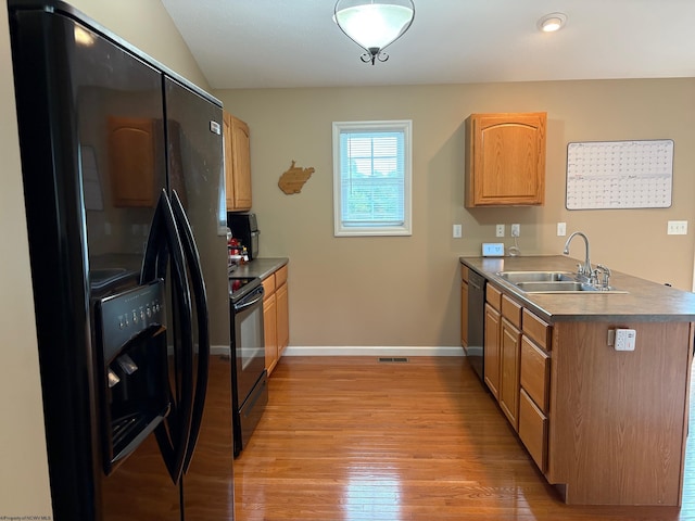 501 Santa Fe Ct, Morgantown, WV 26508 - kitchen featuring black appliances, a sink, light wood-style flooring, baseboards, and a peninsula