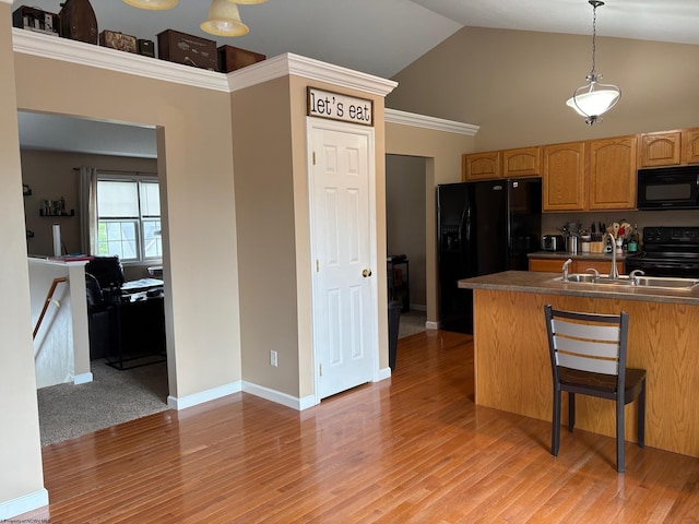 501 Santa Fe Ct, Morgantown, WV 26508 - kitchen with black appliances, a sink, light wood-style flooring, decorative light fixtures, and high vaulted ceiling