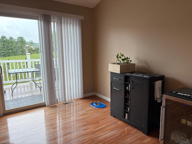 501 Santa Fe Ct, Morgantown, WV 26508 - doorway featuring light wood-style flooring, healthy amount of natural light, baseboards, and wine cooler