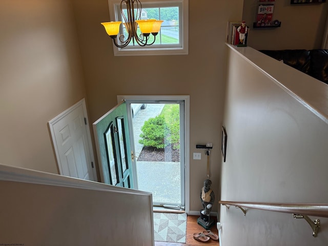 501 Santa Fe Ct, Morgantown, WV 26508 - staircase with a chandelier, a towering ceiling, baseboards, and wood finished floors