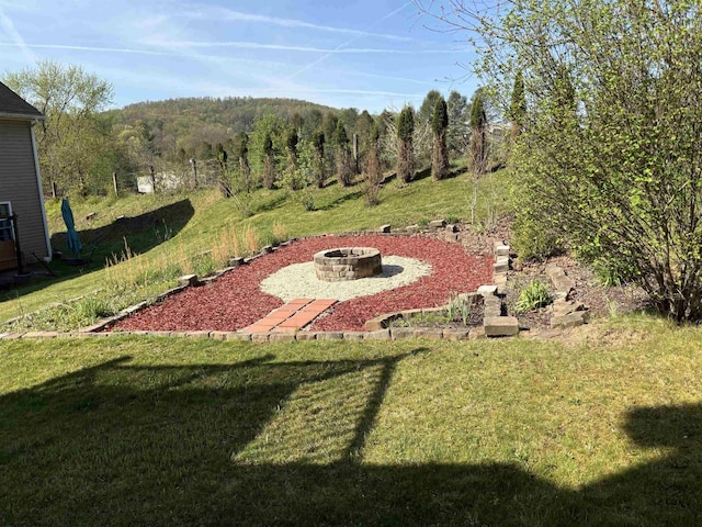 501 Santa Fe Ct, Morgantown, WV 26508 - view of green lawn with a fire pit and a view of trees