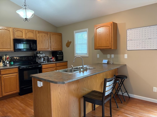 501 Santa Fe Ct, Morgantown, WV 26508 - kitchen featuring black appliances, a sink, dark countertops, and vaulted ceiling