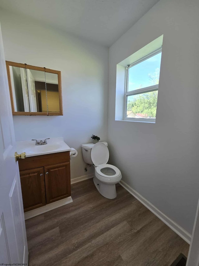 608 Ohio Ave, Nutter Fort, WV 26301 - bathroom featuring toilet, wood finished floors, vanity, and baseboards