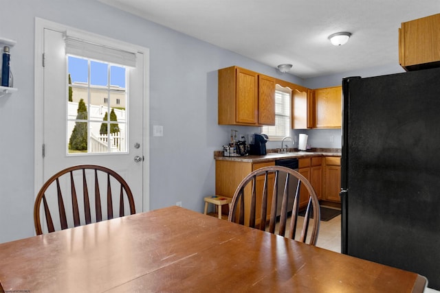 112 Eagle Dr, Maidsville, WV 26541 - kitchen with freestanding refrigerator, a sink, and brown cabinetry