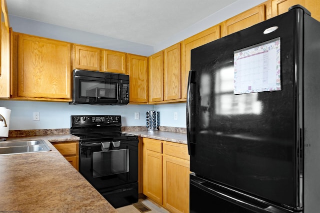 112 Eagle Dr, Maidsville, WV 26541 - kitchen featuring black appliances, a sink, and light countertops