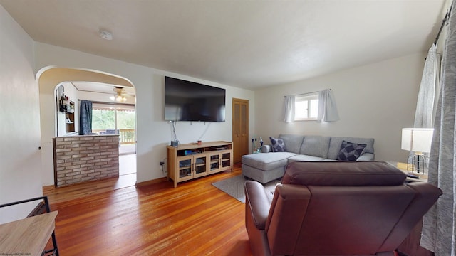 1601 Green Gables Rd, Fairmont, WV 26554 - living room featuring wood finished floors, arched walkways, and baseboards