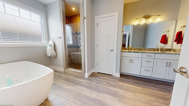 123 Sadie Ln, Morgantown, WV 26508 - full bath featuring a freestanding tub, double vanity, a shower stall, and recessed lighting