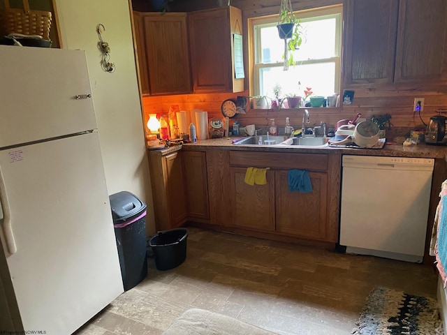 21434 Seneca Trl, Valley Head, WV 26294 - kitchen with white appliances, a sink, brown cabinets, and light wood finished floors