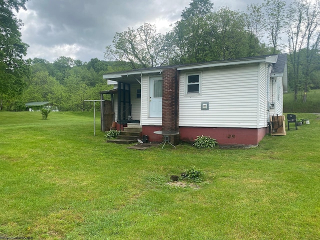 21434 Seneca Trl, Valley Head, WV 26294 - rear view of property with a yard