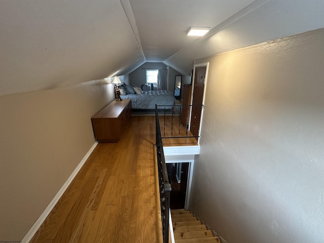 2605 E Main St, Bridgeport, WV 26330 - bedroom featuring vaulted ceiling, light wood finished floors, and baseboards