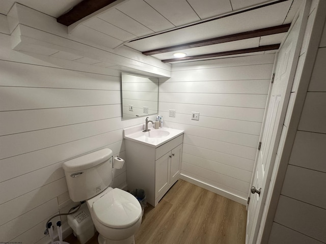 2605 E Main St, Bridgeport, WV 26330 - half bath with wood finished floors, vanity, toilet, and wood walls