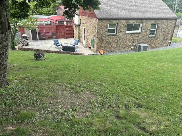 2605 E Main St, Bridgeport, WV 26330 - back of house with roof with shingles, cooling unit, a patio area, and stone siding