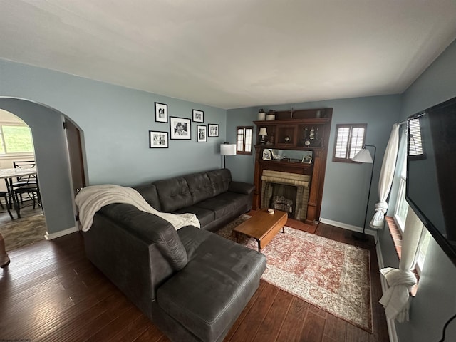 2605 E Main St, Bridgeport, WV 26330 - living area with arched walkways, healthy amount of natural light, dark wood-type flooring, and baseboards
