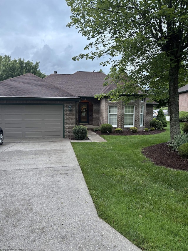 2056 Georgian Mnr, Morgantown, WV 26508 - ranch-style house with a garage, a shingled roof, concrete driveway, a front yard, and brick siding