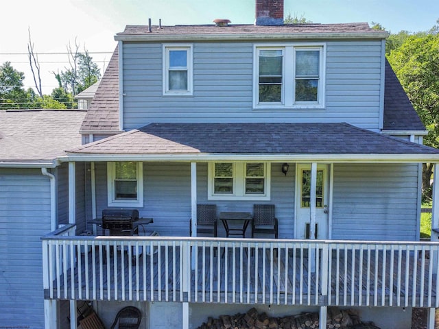 1917 Pleasant Valley Rd, Fairmont, WV 26554 - back of property with a chimney, a shingled roof, and a wooden deck