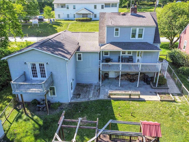 1917 Pleasant Valley Rd, Fairmont, WV 26554 - back of property featuring a chimney, french doors, a wooden deck, a patio area, and a garden