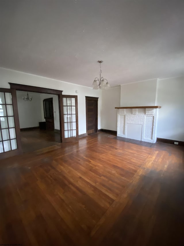 229-231 Meigs Ave Unit 2, Clarksburg, WV 26301 - unfurnished living room with a chandelier, wood finished floors, and baseboards
