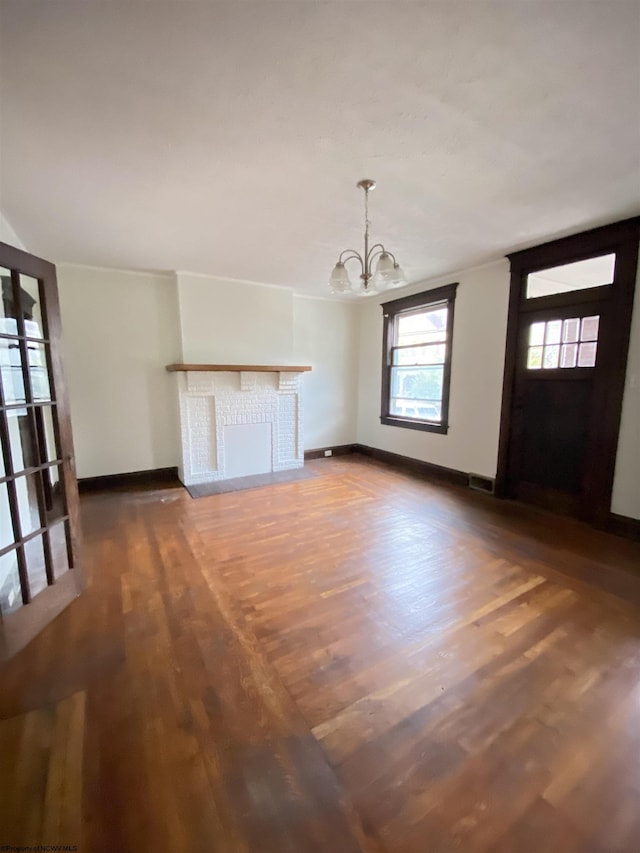 229-231 Meigs Ave Unit 2, Clarksburg, WV 26301 - unfurnished living room with a chandelier, wood finished floors, baseboards, and a fireplace