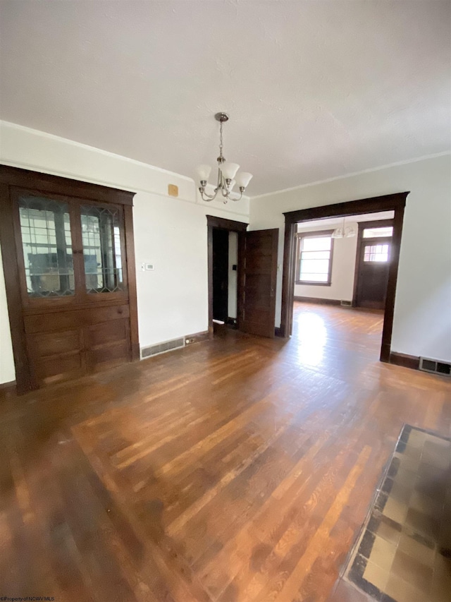 229-231 Meigs Ave Unit 2, Clarksburg, WV 26301 - unfurnished dining area featuring a chandelier, wood finished floors, and baseboards