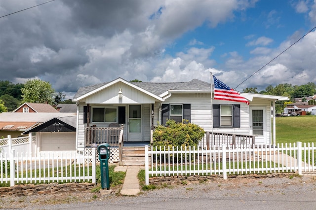1501 Rose Ln, Fairmont, WV 26554 - bungalow featuring covered porch, a fenced front yard, and roof with shingles