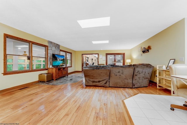 237 Highland Ave, Grafton, WV 26354 - living area featuring wood-type flooring, a skylight, and baseboards