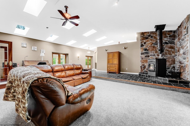 237 Highland Ave, Grafton, WV 26354 - living area with a skylight, carpet floors, vaulted ceiling, a wood stove, and ceiling fan