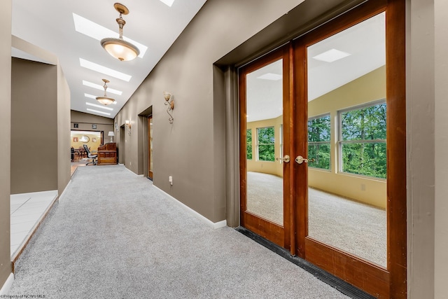 237 Highland Ave, Grafton, WV 26354 - hallway with a skylight, carpet floors, lofted ceiling, french doors, and baseboards