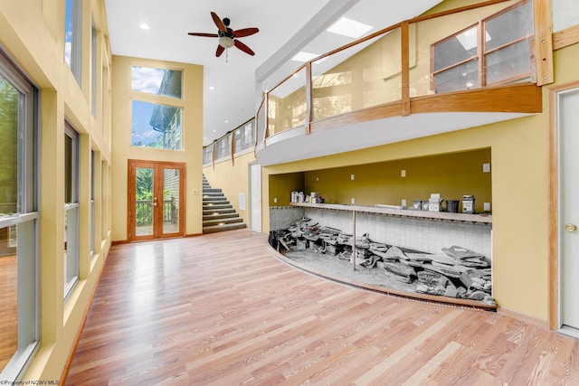 237 Highland Ave, Grafton, WV 26354 - interior space featuring a high ceiling, wood finished floors, a ceiling fan, stairway, and french doors