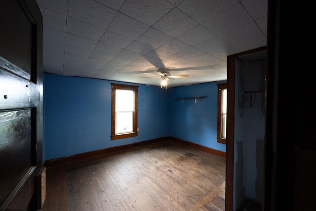 248 Casteel Rd, Terra Alta, WV 26764 - spare room with baseboards, wood-type flooring, and a ceiling fan
