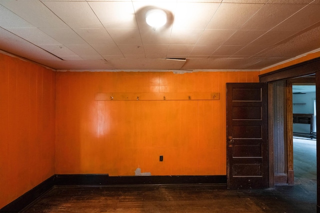 248 Casteel Rd, Terra Alta, WV 26764 - spare room with wood-type flooring, baseboards, and wood walls