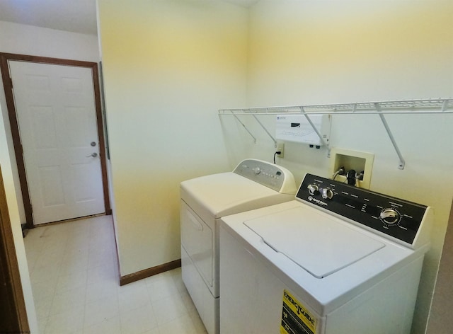 183 Camp Mountaineer Rd, Morgantown, WV 26508 - laundry room featuring washing machine and clothes dryer, light floors, and baseboards