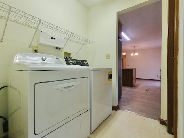 183 Camp Mountaineer Rd, Morgantown, WV 26508 - laundry area with independent washer and dryer, baseboards, a chandelier, and light flooring