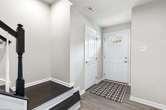 233 Stonehurst Dr, Morgantown, WV 26501 - foyer entrance featuring wood finished floors, baseboards, and stairs
