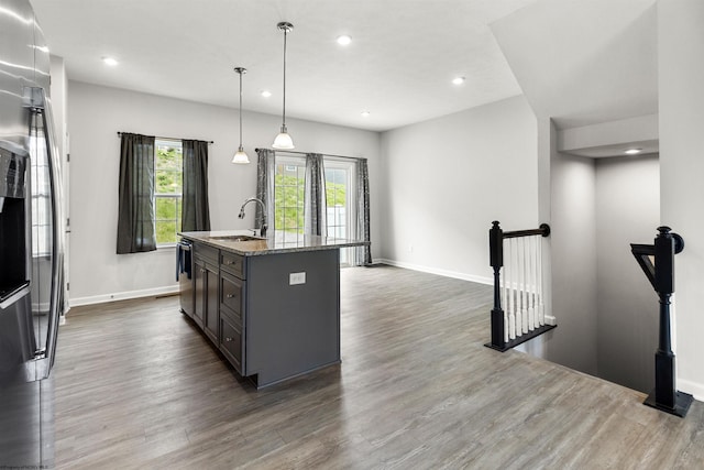 233 Stonehurst Dr, Morgantown, WV 26501 - kitchen with a sink, dark wood-style floors, light stone counters, baseboards, and recessed lighting
