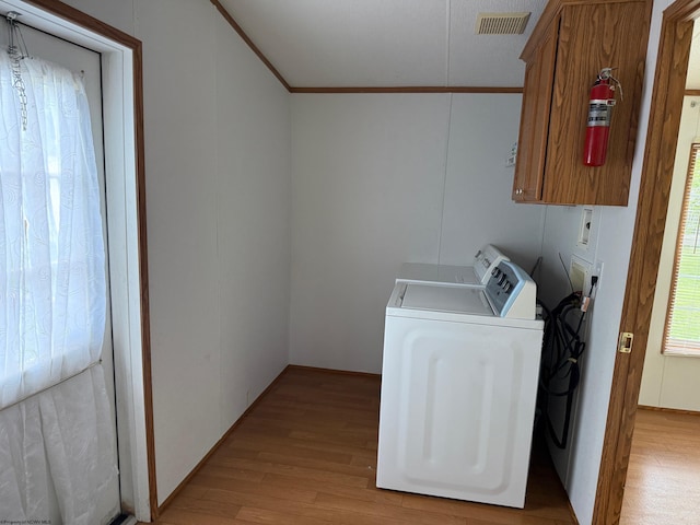 227 Wamsley Way, Valley Bend, WV 26293 - laundry room with washer and dryer, light wood finished floors, ornamental molding, and cabinet space
