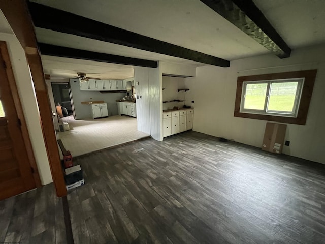 15 Carl Zinn Rd, Independence, WV 26374 - unfurnished living room with beam ceiling, dark wood-style flooring, and a ceiling fan